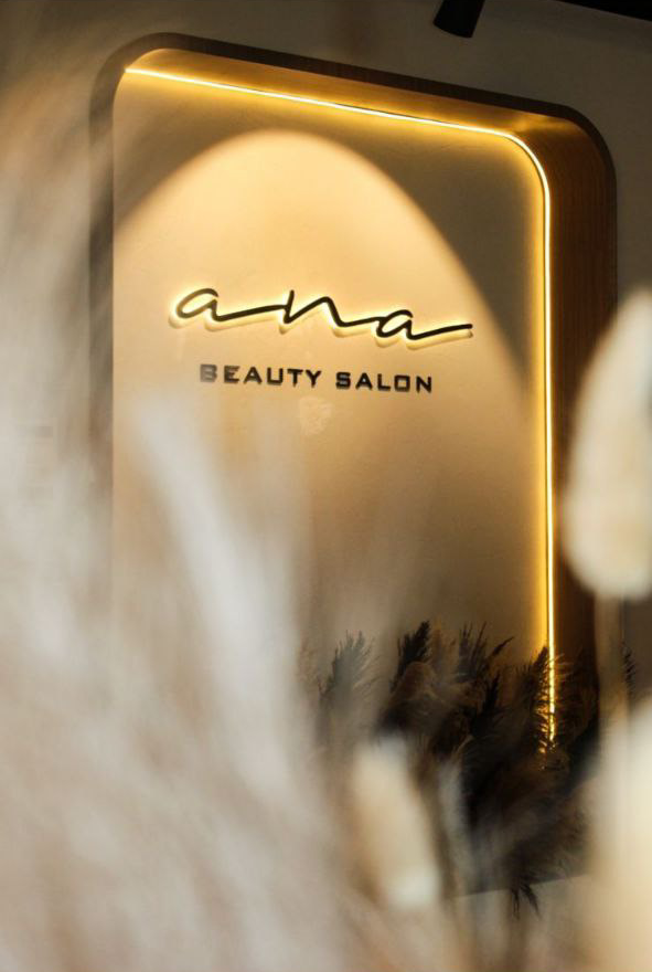 Upscale beauty salon at Kay Homes, showcasing luxurious styling stations and a sophisticated design.