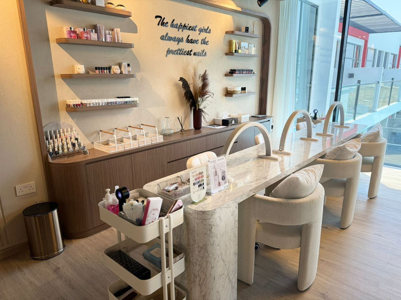 Luxury beauty salon reception area at Kay Homes, featuring a sleek counter and elegant decor.
