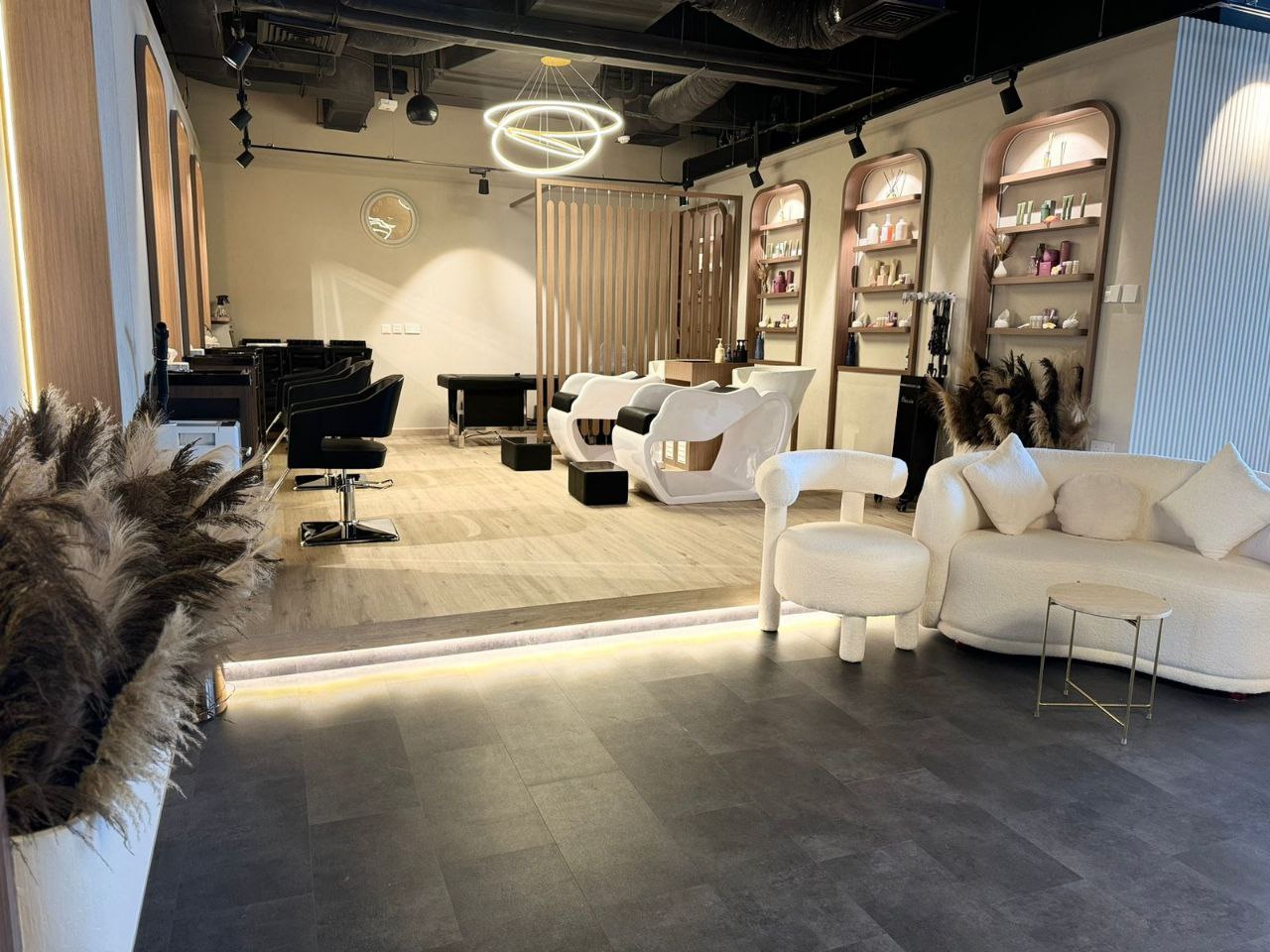 Stylish beauty salon at Kay Homes, featuring modern styling stations and a chic, contemporary design.